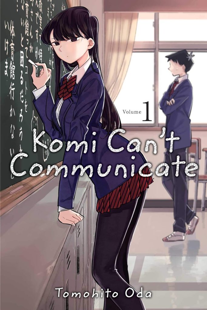 Komi Can't Communicate by Tomohito Oda, manga book cover depicting a schoolgirl writing on a chalkboard in a classroom, with a schoolboy standing by.