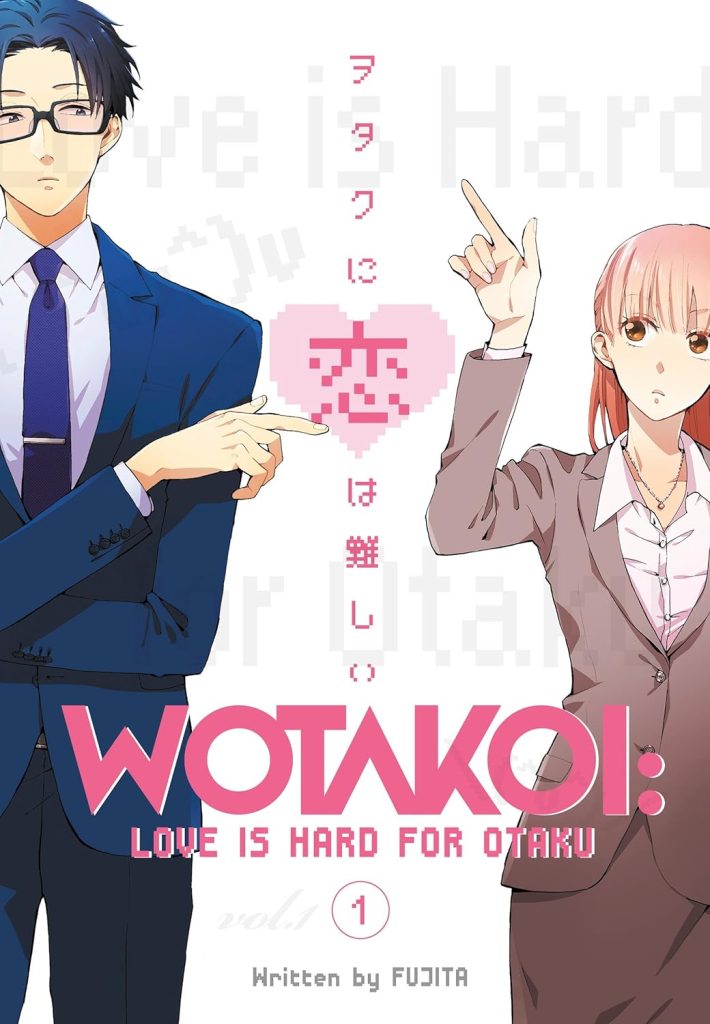 WOTAKOI: Love is Hard for Otaku by Fujita, manga book cover depicting a young man and young woman in office uniforms pointing at each other on a white background with a pink heart in the center, and text all over.