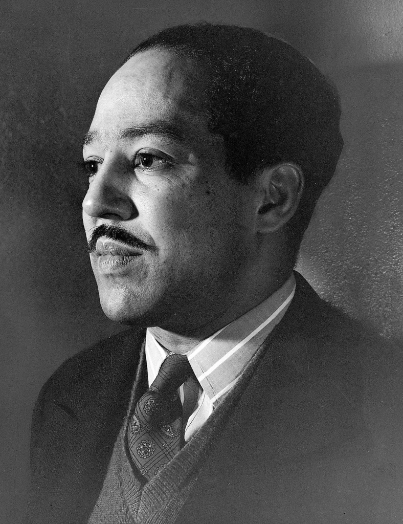 Langston Hughes wearing a suit and tie. 