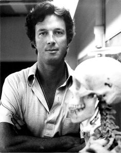 Black and White portrait of a young Michael Crichton