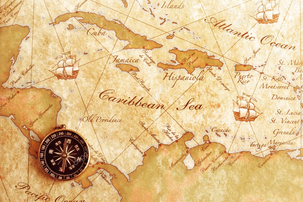 A compass resting on a map.