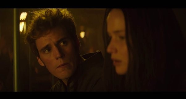 Finnick looking at Katniss with concern.