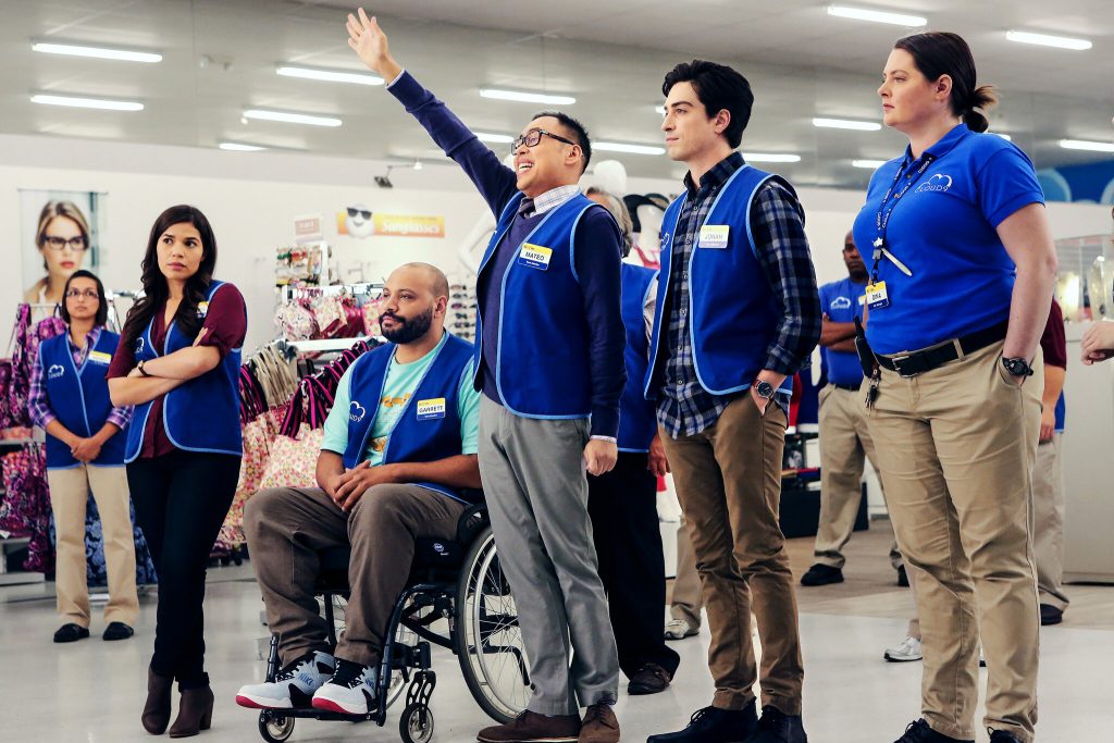 The cast of Superstore standing in a line. 