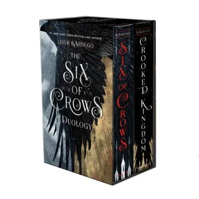 Six of Crows series with a black wing on the front of it.