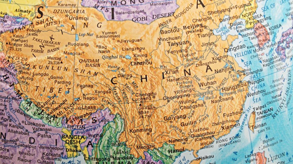 On a globe, the country of China and all of the major cities and landforms are visualized in a bright orange.