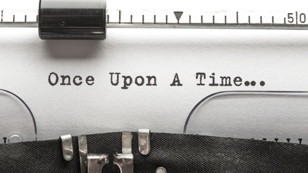 Type writer with a paper that says "Once Upon A Time"