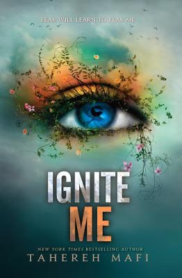 Ignite Me cover by Tahereh Mafi with an eye that has vines and flowers growing out of it. 