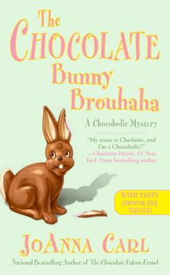 A chocolate bunny with part of its left ear missing faces the viewer against a light green background. "The Chocolate Bunny Brouhaha" is in a yellow-pink font.