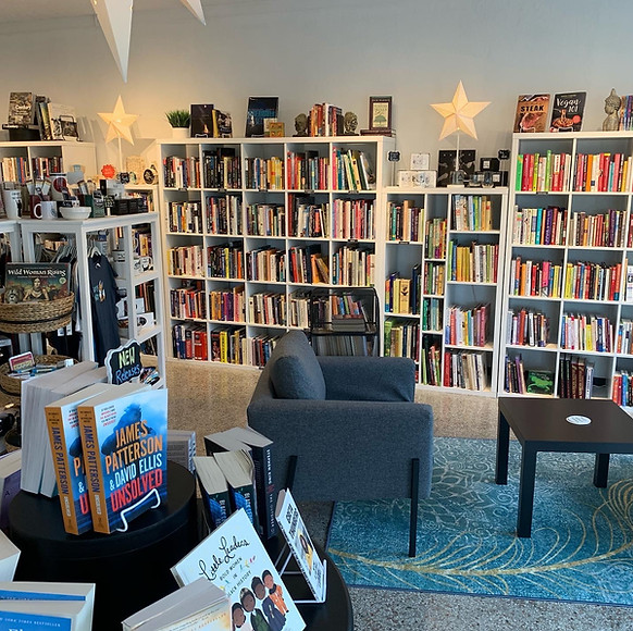 Bookshelves and a lounge area inside Hello Again Books.