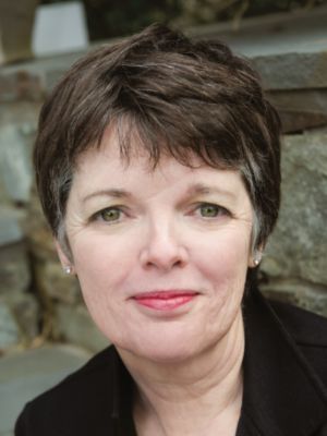 Alice Mcdermott with a black shirt, looking at the camera.