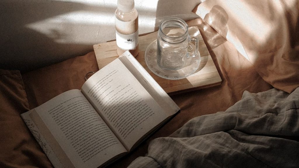 Cozy book spot with blankets and pillows