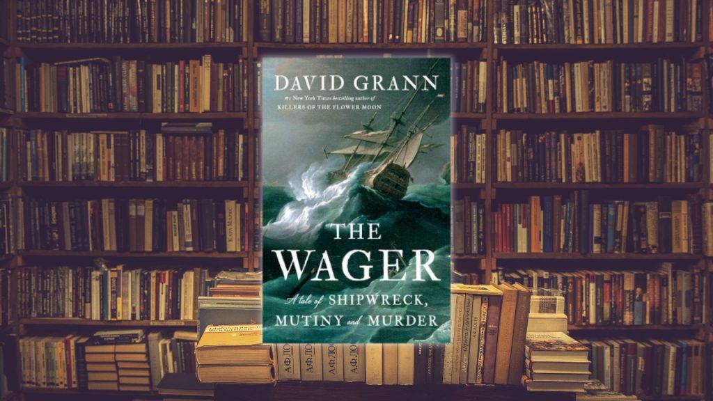 Book cover image of The Wager by David Grann against a background of stacked library bookshelves.