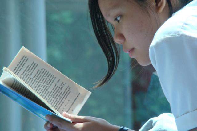Woman reading a book.