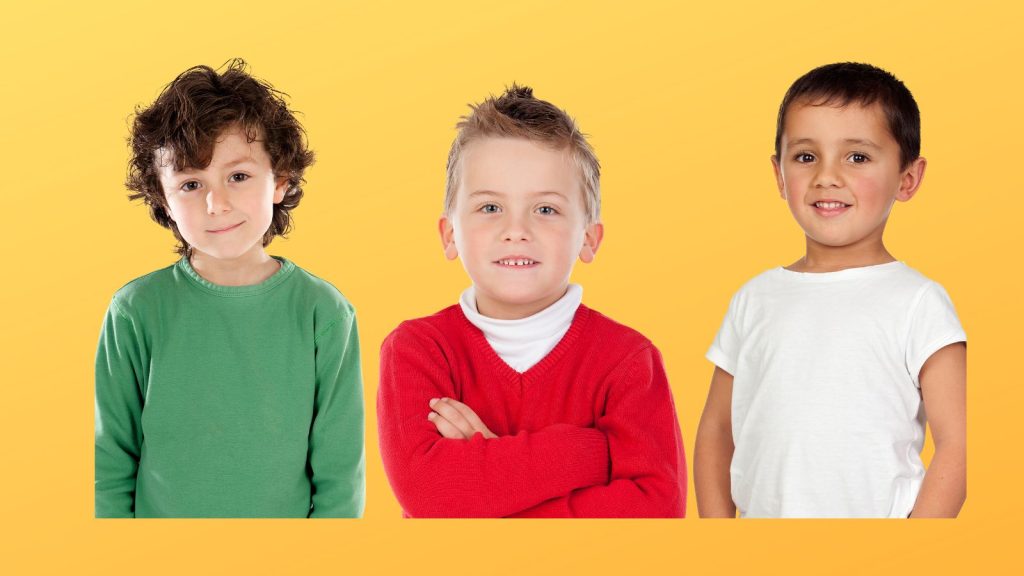 Three young boys on a yellow background.
