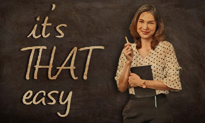 Woman standing next to whiteboard with the message 'it's that easy'.
