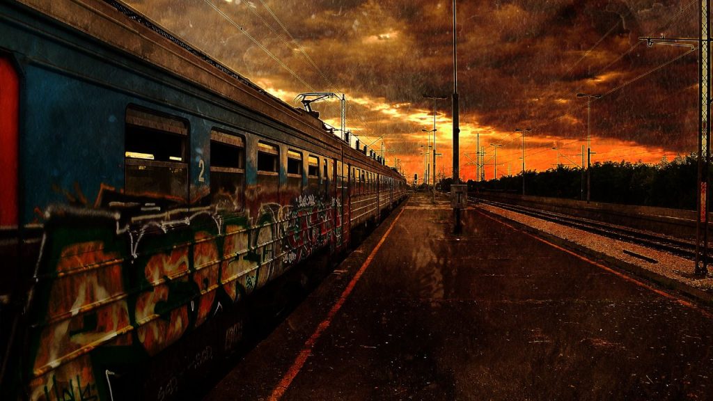 Train and a dark sky to symbolize the feeling of a post-apocalyptic world.