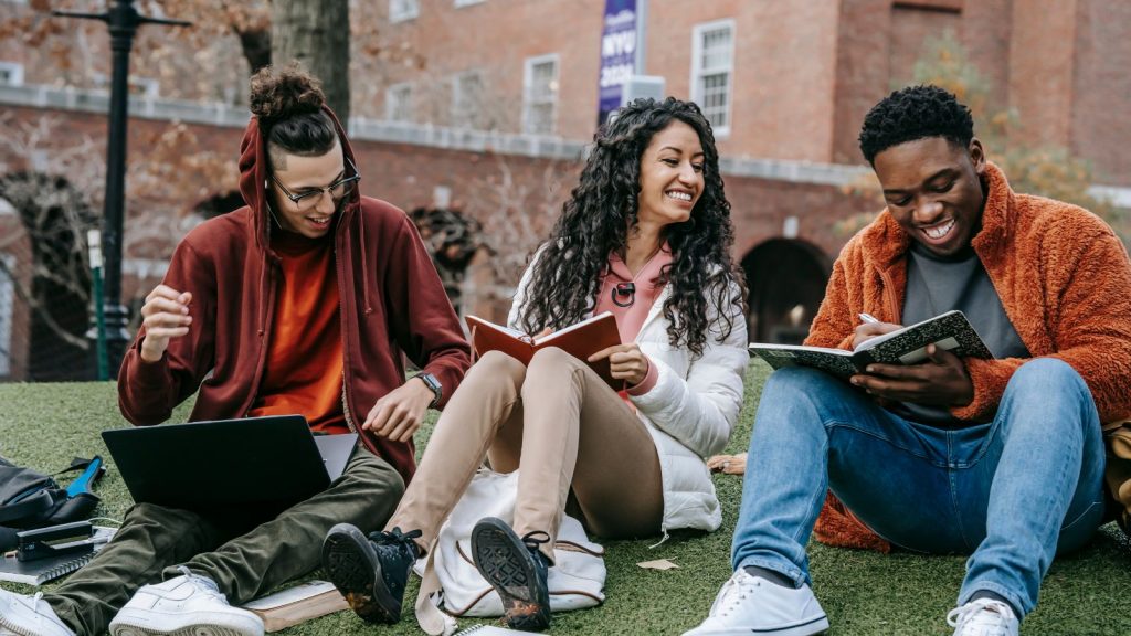 People reading books outside.