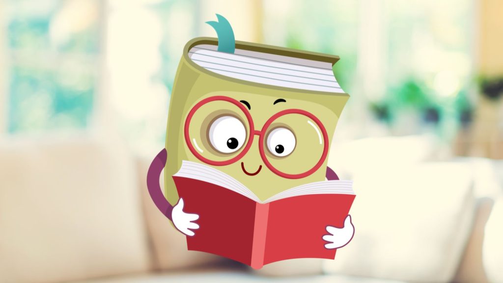 A green book with red glasses reading a red book on a white couch with an off-focus living room background.
