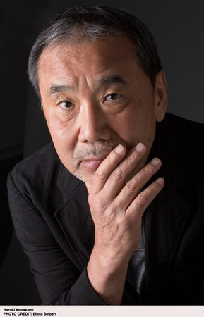 Image of Haruki Murakami staring at camera with his hand on his chin.