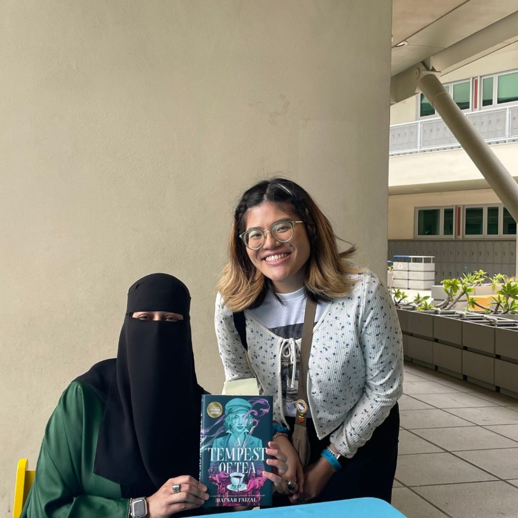 Article writer with author Hafsah Faizal.