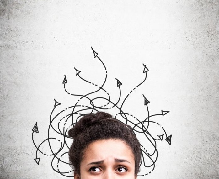 Confused woman with arrows coming out of her head.