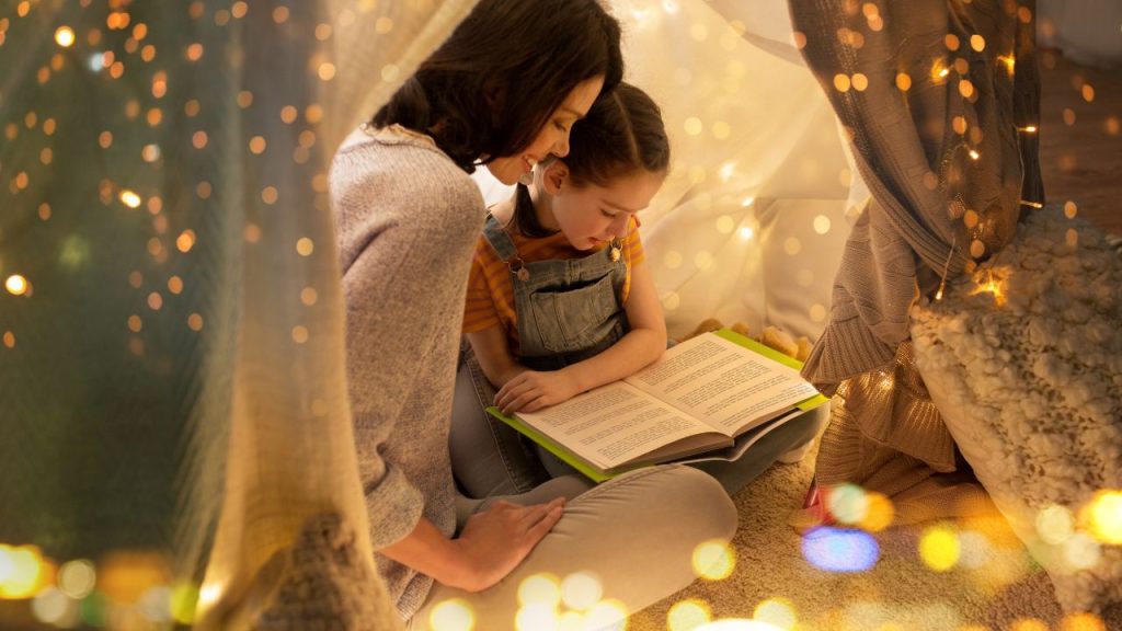 Mother reading with daughter