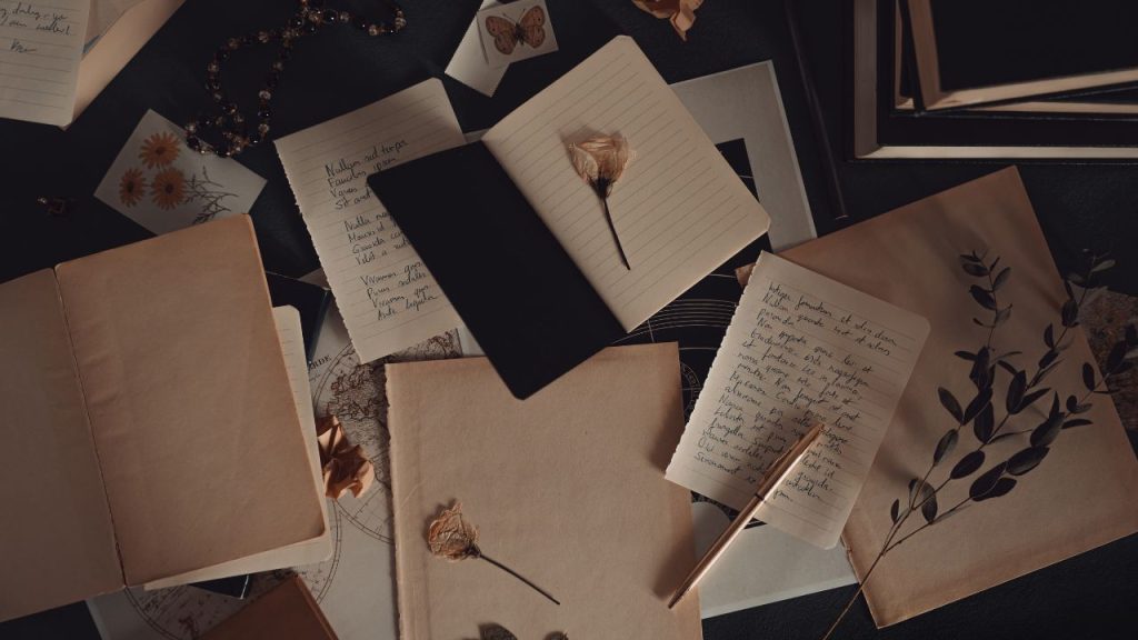 pages and flowers spread on the floor