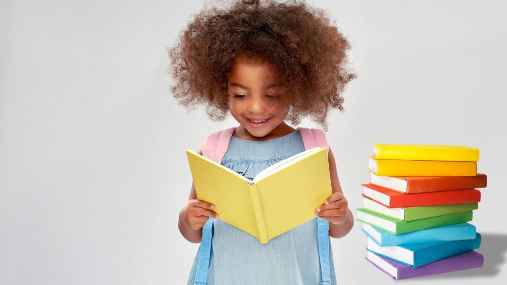 Little girl reading books.