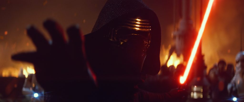 Kylo Ren reaches for the camera, ready to swing.