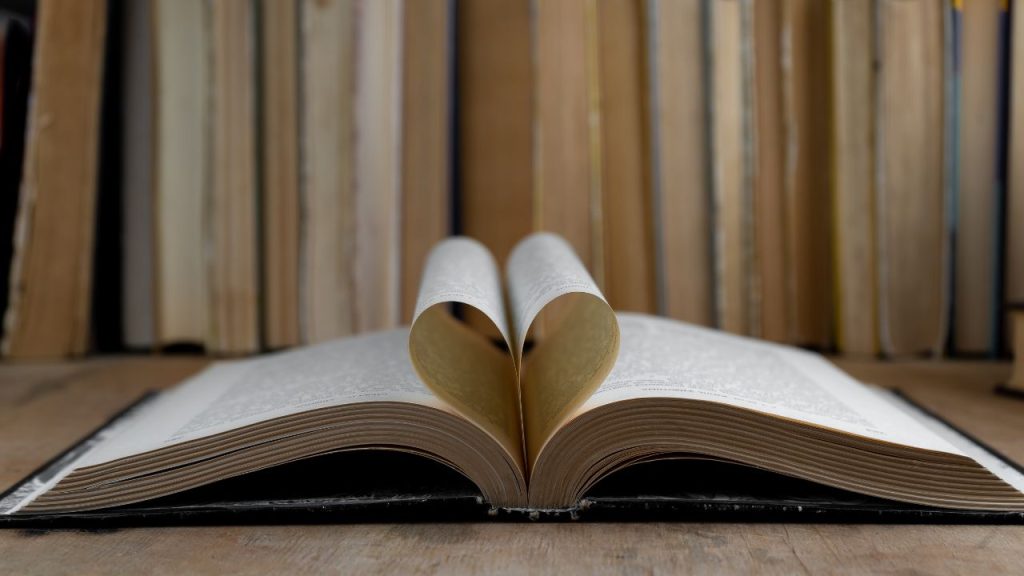 Open book with a heart made with the pages