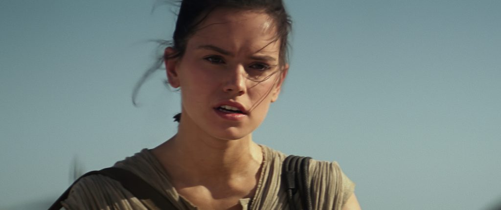 A still image of Rey from The Force Awakens
