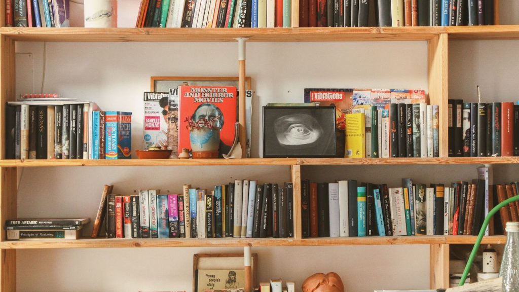 book shelves filled with books and pictures and knick knacks
