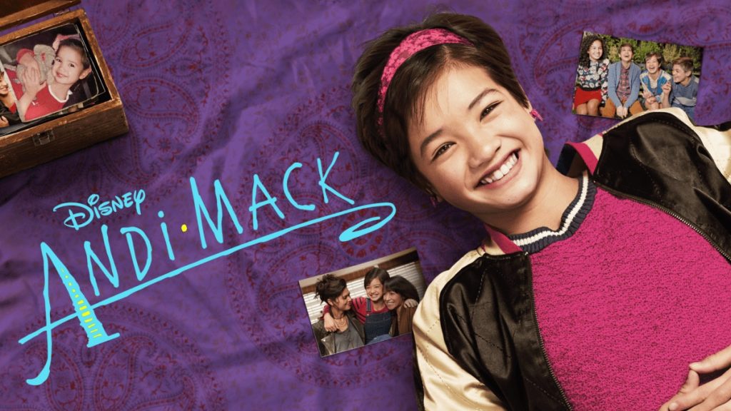 Andi Mack poster for Disney with a girl laying down on a purple blanket next to three pictures of her with friends and as a baby.