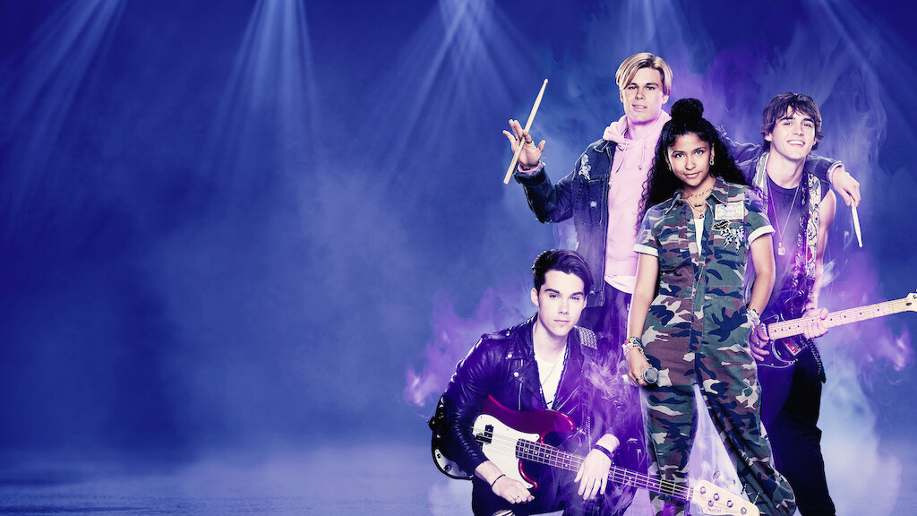 Purple background with four bandmates on the right side. One girl holding a microphone in the center with three boys around her, two with guitars and one with a drumstick.
