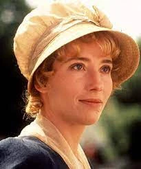 Elinor Dashwood looking to the side with a smile.