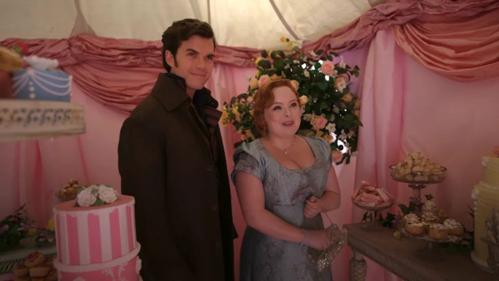 Colin and Penelope smiling side by side in the deserts tent.