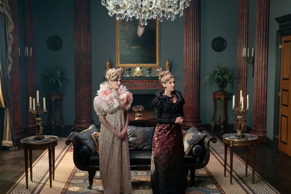 Cressida Cowper and her mother in their unwelcoming family home, with Cressida donning oversized pink, floral sleeves.