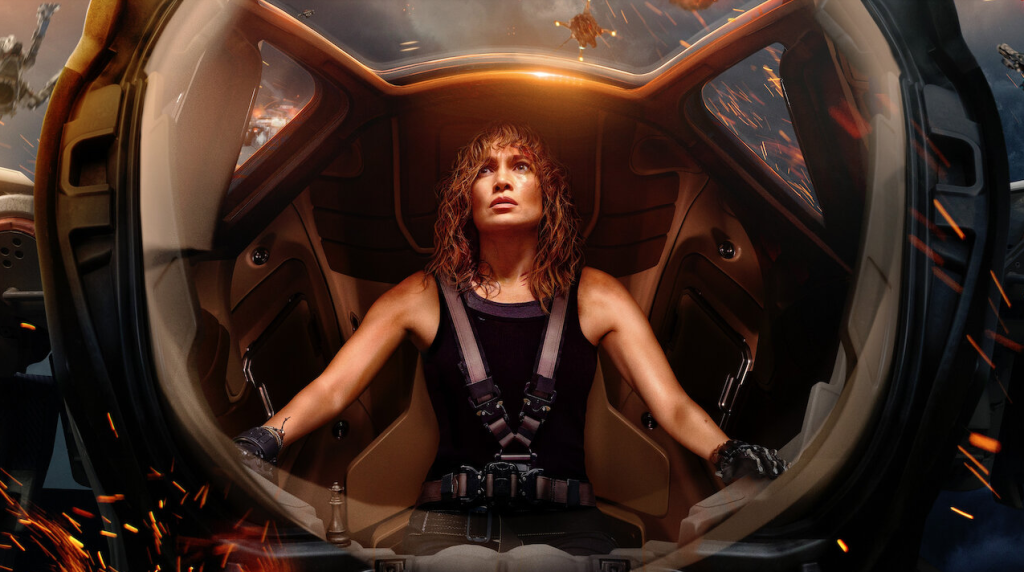 Movie cover of Jennifer Lopez in 'Atlas' on Netflix. Looking scared away from the camera in a capsule wearing all black.