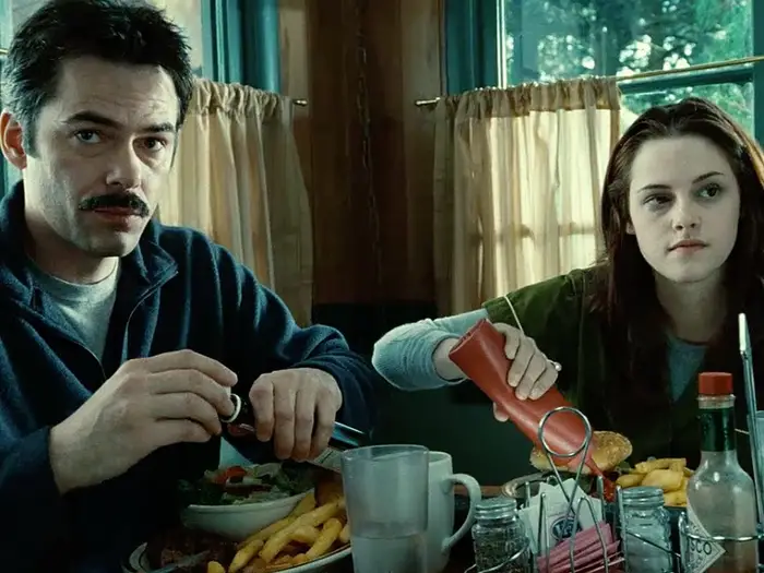 Charlie Swan from The Twilight Saga. Charlie and Bella eating at the diner.