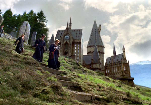 Photo of Hermione, Harry, and Ron walking in front of Hogwarts in THE PRISONER OF AZKABAN