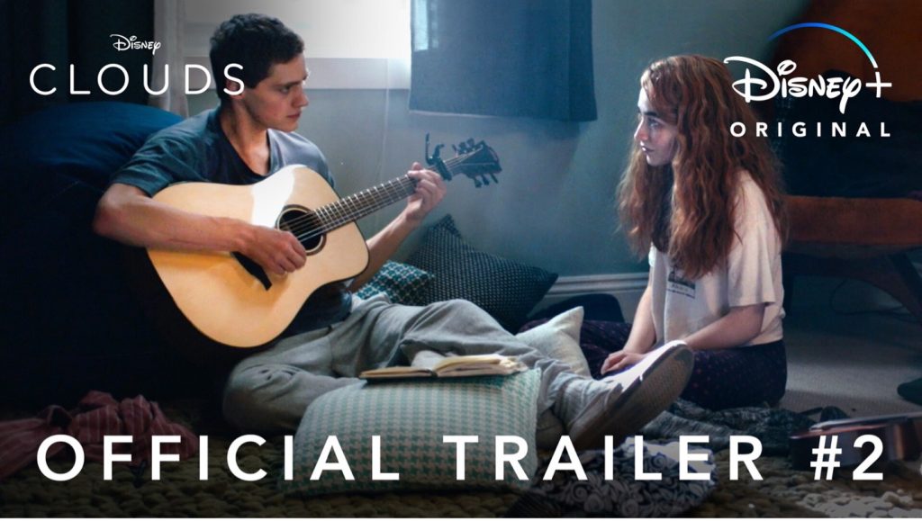 Cover for Disney+'s original movie "Clouds" with a boy playing the guitar and a girl watching watching him on his bedroom floor.