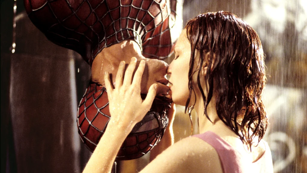 Scene from Spiderman -- Spiderman and Mary Jane performing the upside-down kiss in the rain.