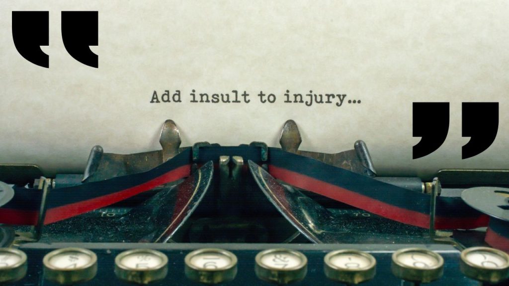 A typewriter with a paper that says "Add insult to injury..."