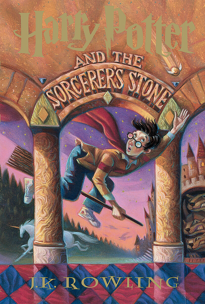 Harry Potter and the Sorcerer's Stone cover, young boy on a broom reaching for the golden snitch.