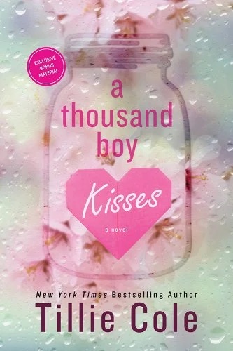 Book cover for 'A Thousand Boy Kisses' by Tillie Cole featuring water droplets on top of a mason jar with pink blurry flowers.