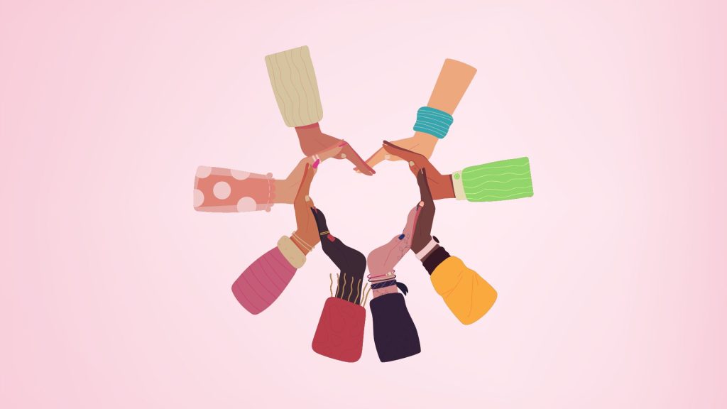 Diverse hands forming a heart
