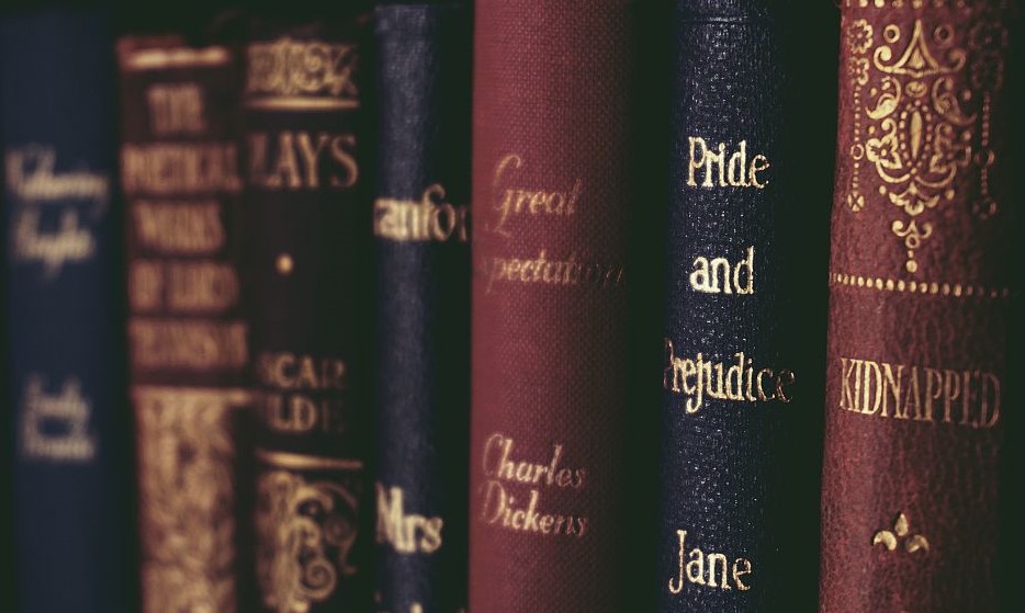 Books like 'Pride and Prejudice' and 'Great Expectations' lined up on a shelf
