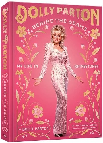 A bright pink background with gold flowers and lettering featuring Dolly Parton wearing a light pink rhinestone covered dress.