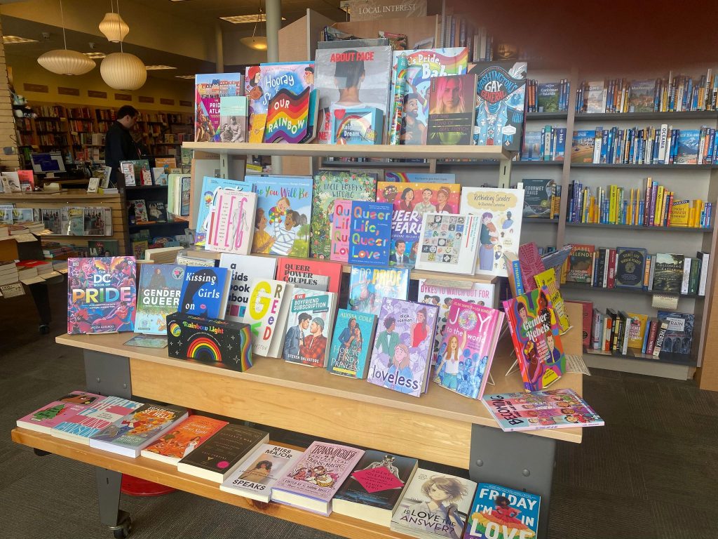 A pride display at Books Inc. showing various books about and by LGBTQ+ people.