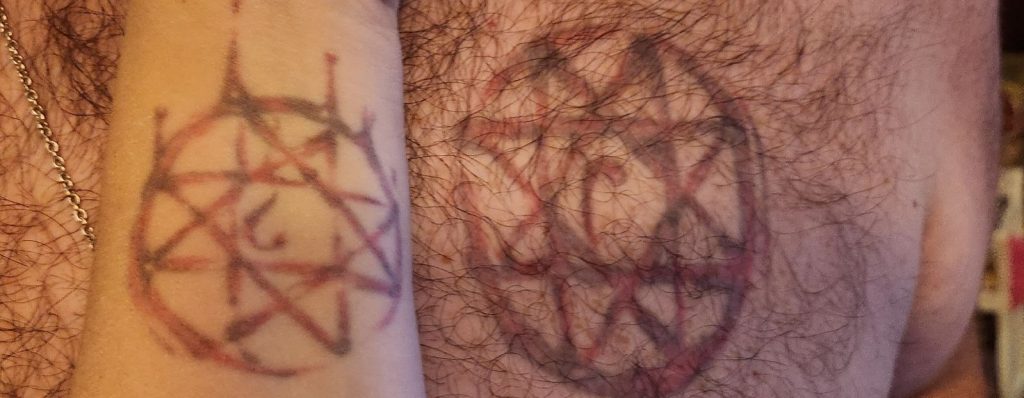Two tattoos of the Full Metal Alchemist blood seal with half a heart in the middle.